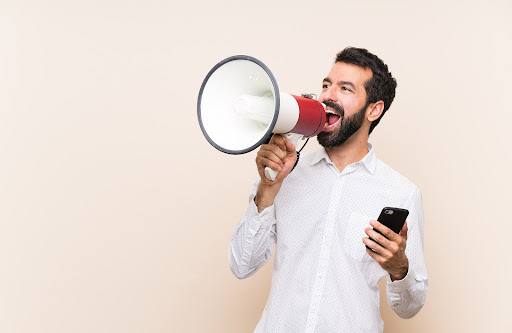 man using megaphone | communication in HOA